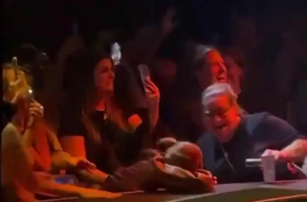 The fan will probably regret her screen time at the gig (X)