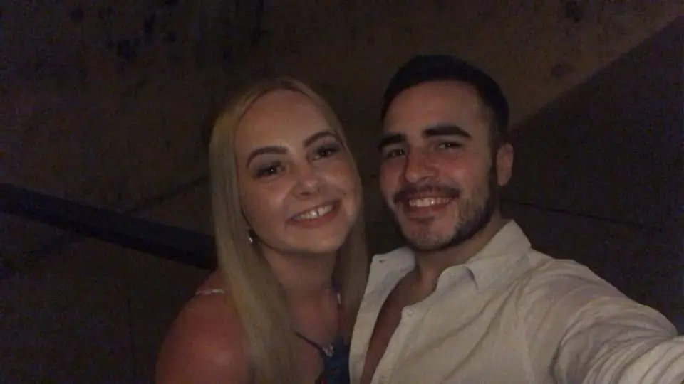 Alex, pictured with his wife Ellé, discovered he had a large tumor on him eight months later (GoFundMe)