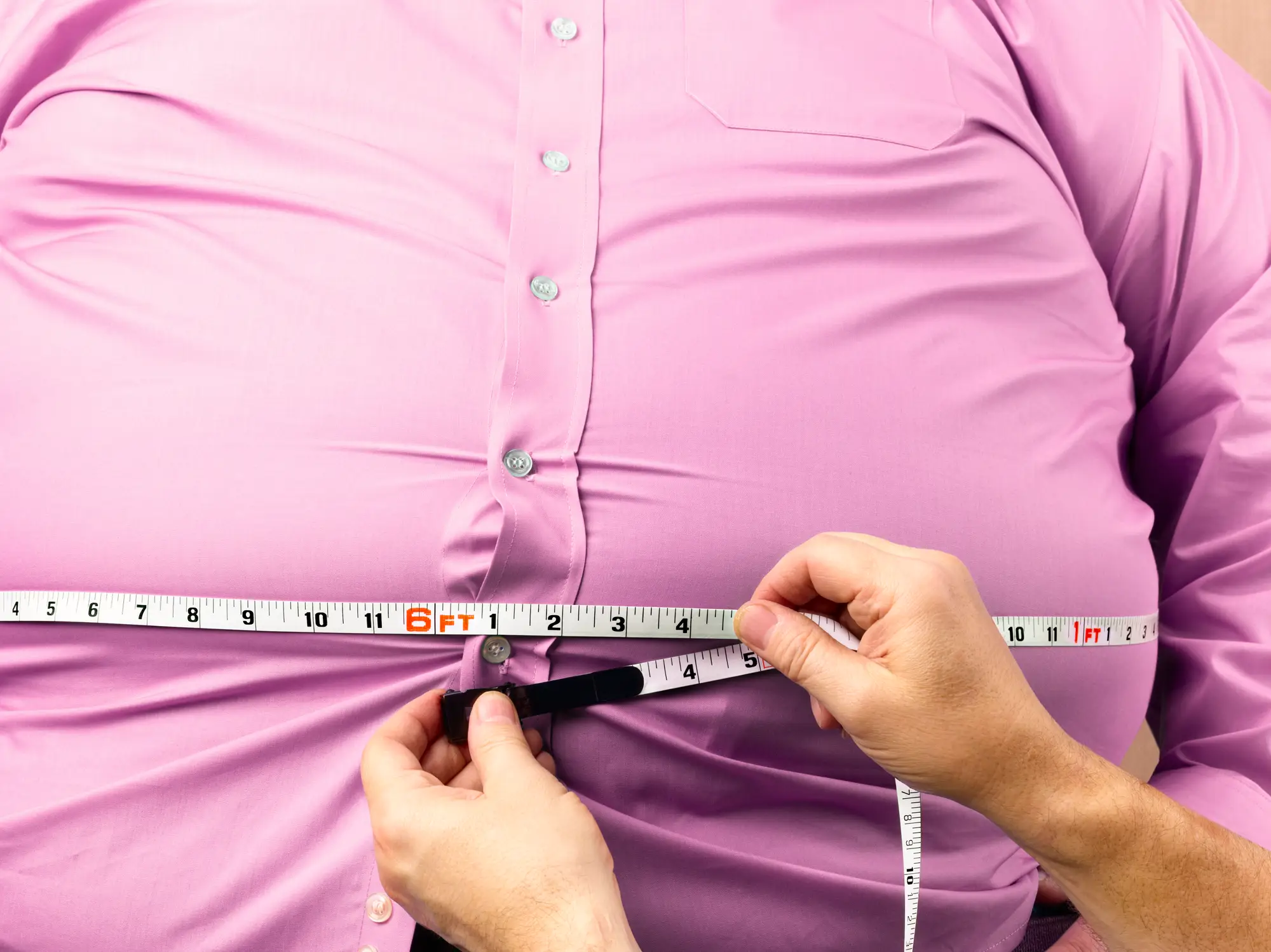 Men who are overweight might find that their manhood appears smaller (Getty Stock)