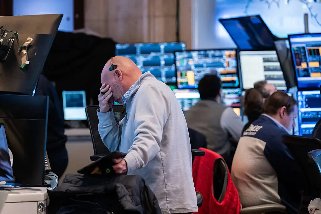 Traders work on the floor of the New York Stock Exchange during morning trading last week (Adam Gray/Getty Images)