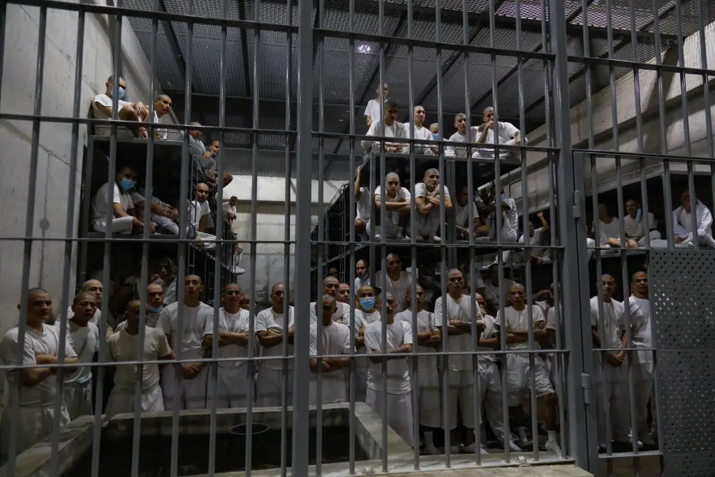 Inmates sleep on multi-layer metal beds. (Alex Peña/Getty Images)