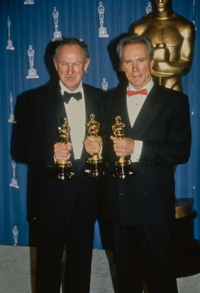 Gene grips both of his Oscars alongside Clin Eastwood (Vinnie Zuffante/Getty Images)