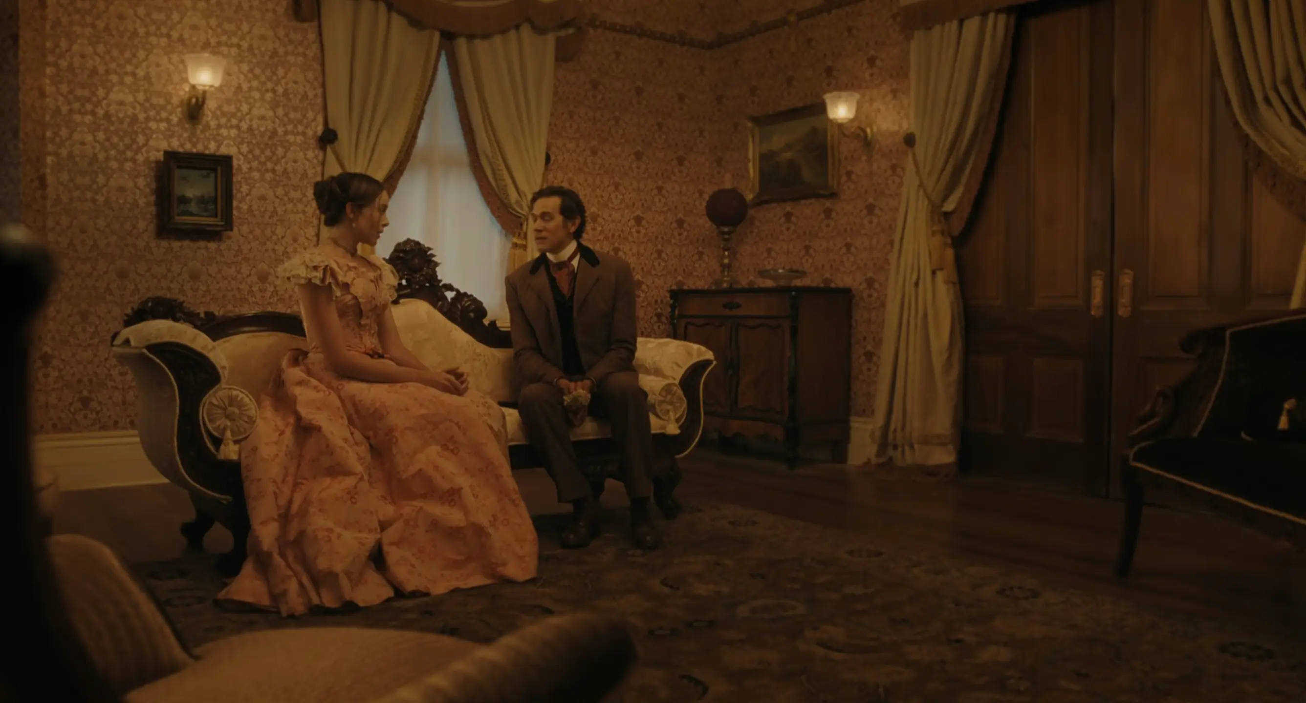 Lizzie and a suitor speak in the first episode of Monster: The Lizzie Borden Story. (Netflix)