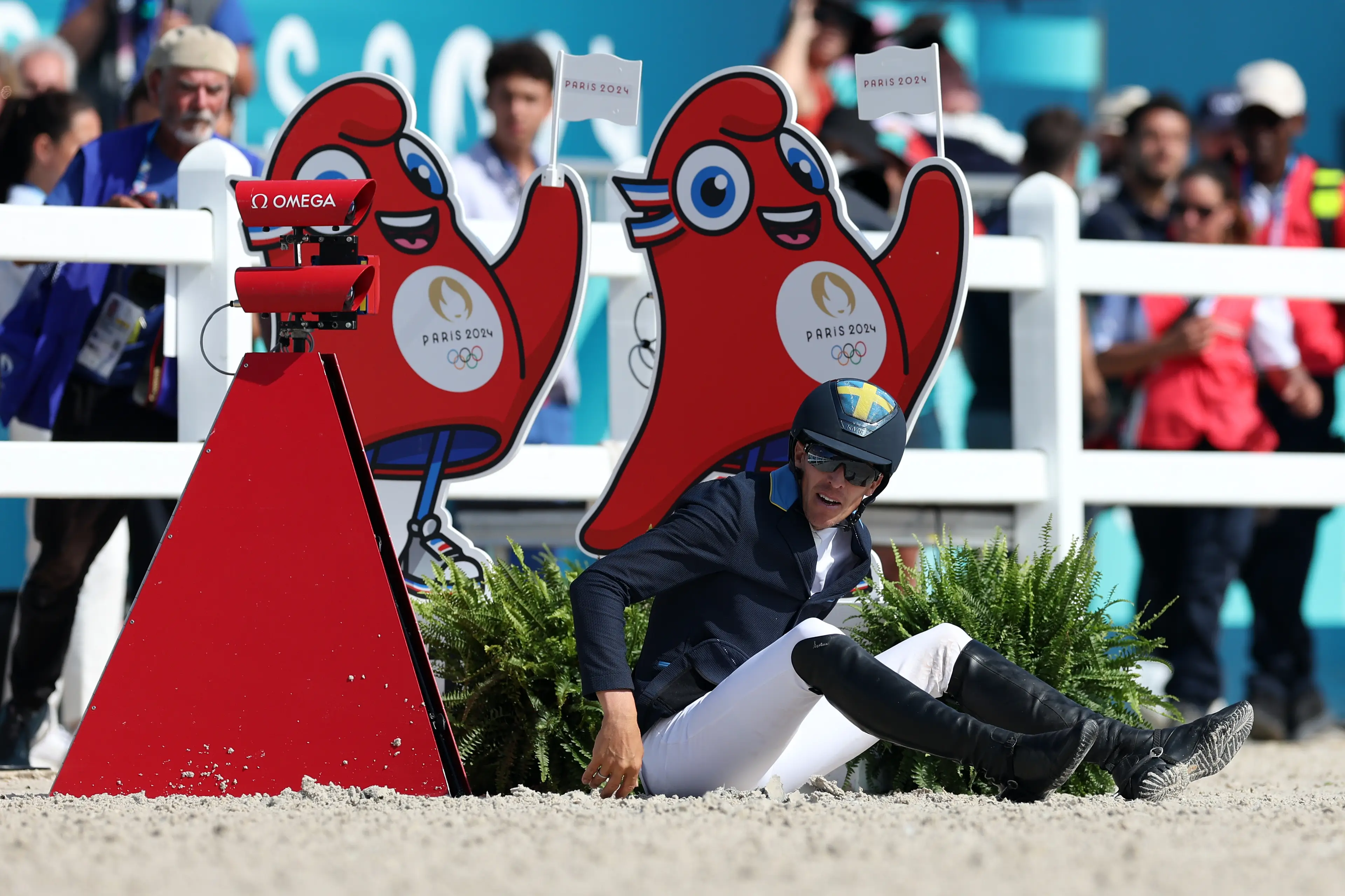 It seems Von Eckermann's horse lost its balance and flung its rider to the side. (Alex Broadway/Getty Images)