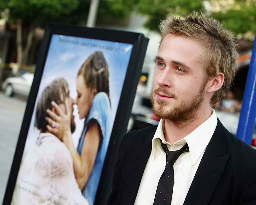 Ryan Gosling with The Notebook poster in the background at a premiere in 2004. (Kevin Winter/Getty Images)