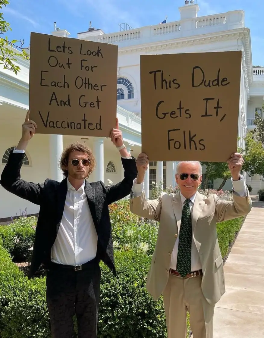 Phillips with former President Joe Biden while he was in office back in 2021 (Instagram/dudewithsign)