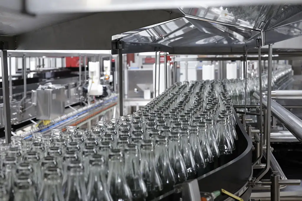 There's a reason why the drink tastes different in a glass bottle compared to a can (STEPHANE DE SAKUTIN/AFP via Getty Images)