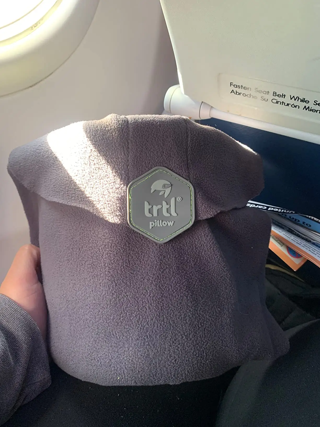 Customers say the travel pillow prevents neck pain on flights (Amazon reviews)