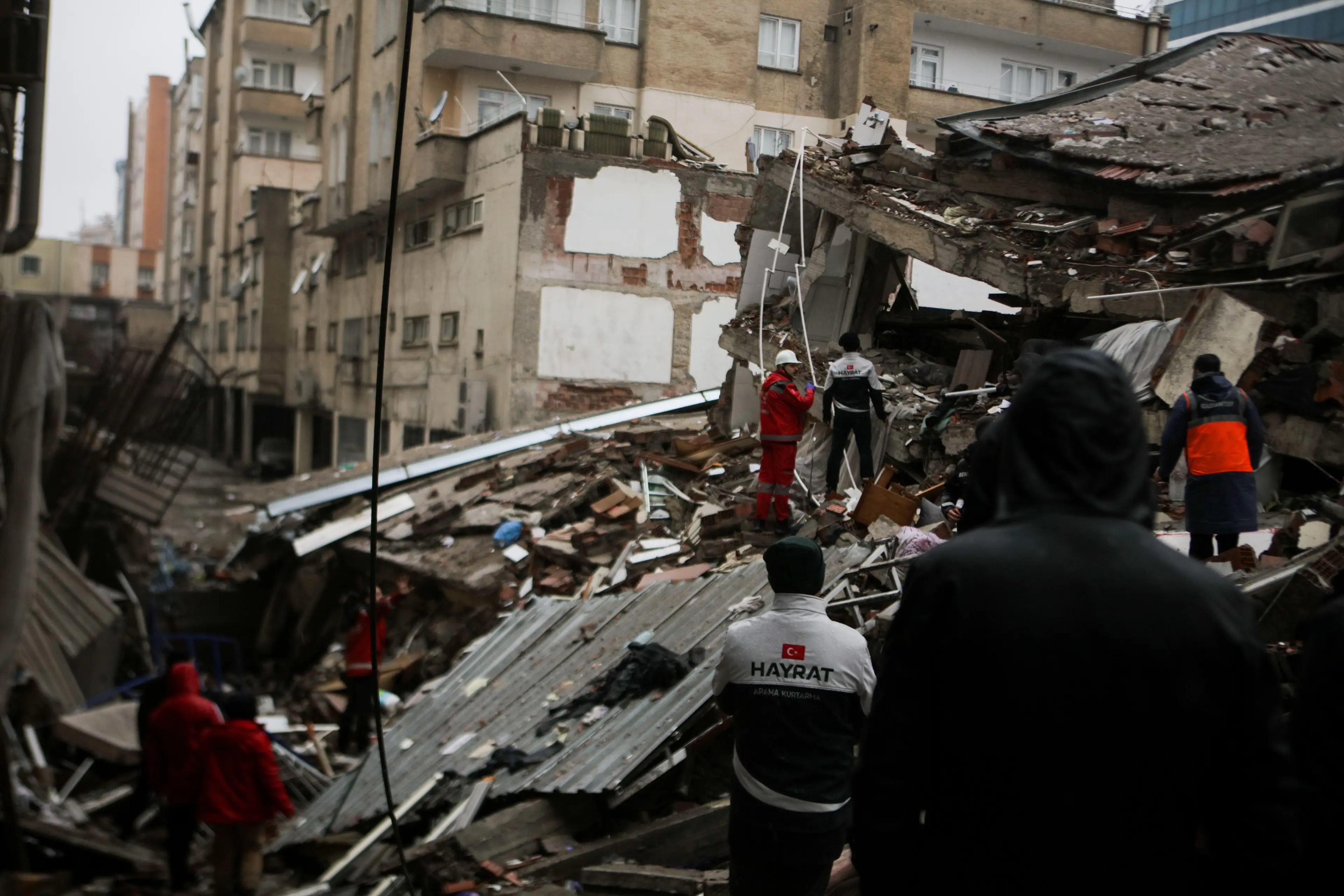 Rescuers operations are undertaken to save people trapped beneath the rubble.
