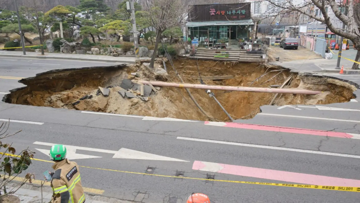 The chasm spans four lanes (ANTHONY WALLACE/AFP via Getty Images)