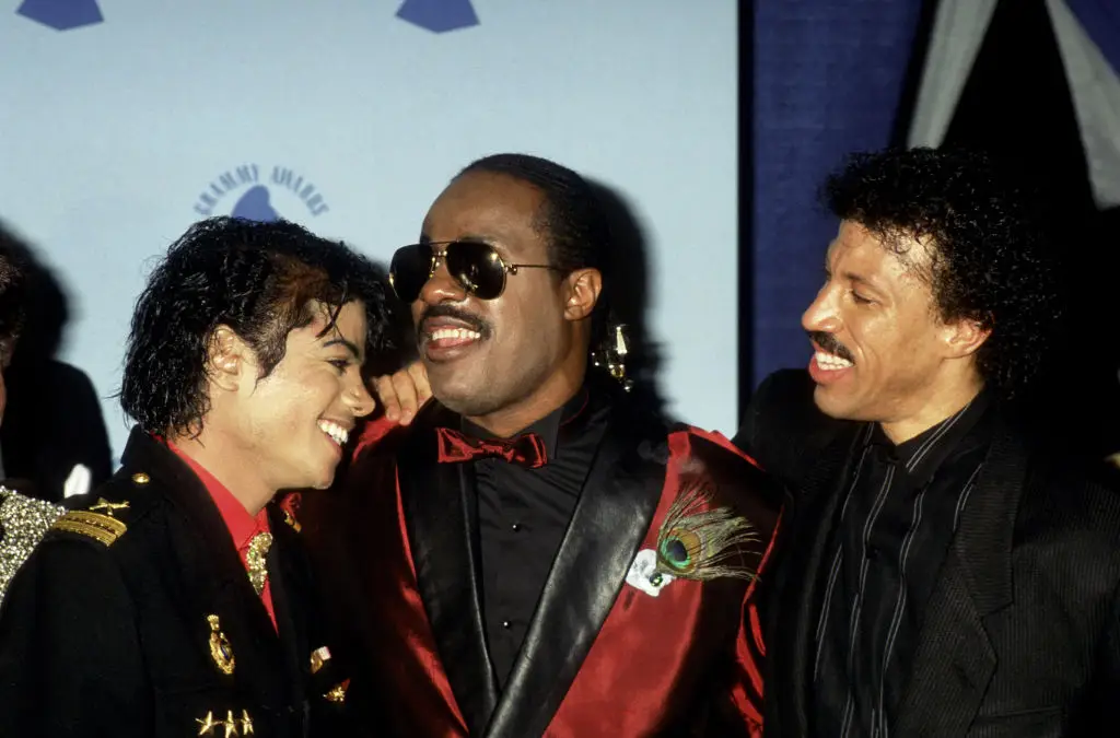Richie, pictured alongside Jackson and Stevie Wonder in 1996, explained how he and Quincy Jones used to call the King of Pop 'smelly' (Ron Galella/Ron Galella Collection via Getty Images)