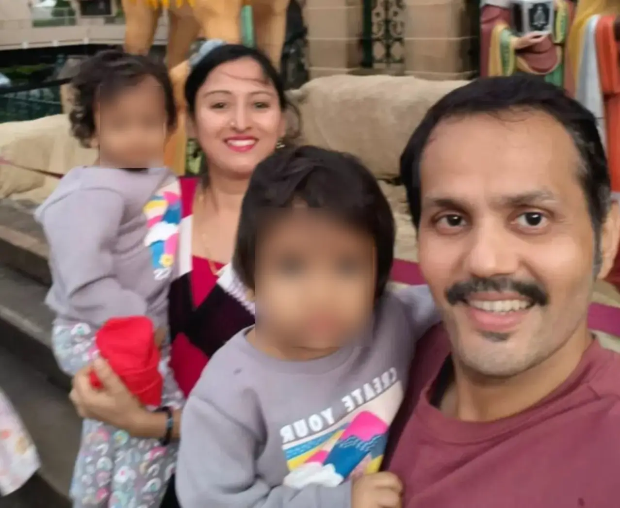 Anand Runwal, seen with his wife and daughters, died on Sunday. (Facebook)