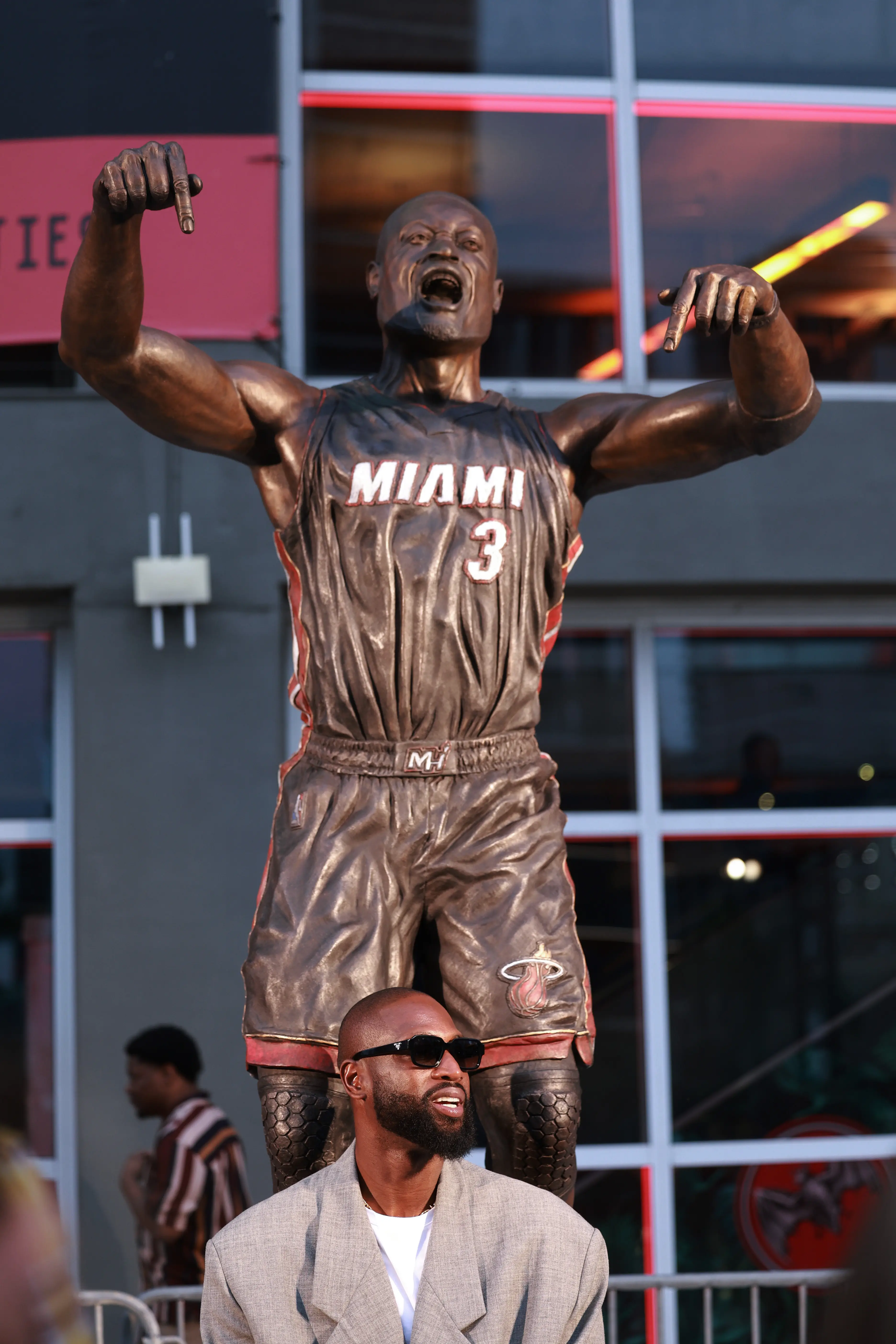 Wade in front of his statue (Carmen Mandato/Getty Images)