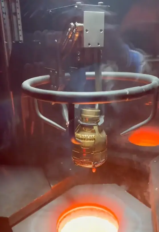 The solid gold bottle was dipped into lava.