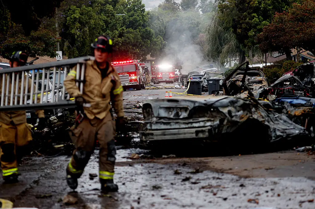 The small private jet crashed in the Murphy Canyon neighborhood on Thursday morning, resulting in the deaths of all six people onboard (SANDY HUFFAKER/AFP via Getty Images)