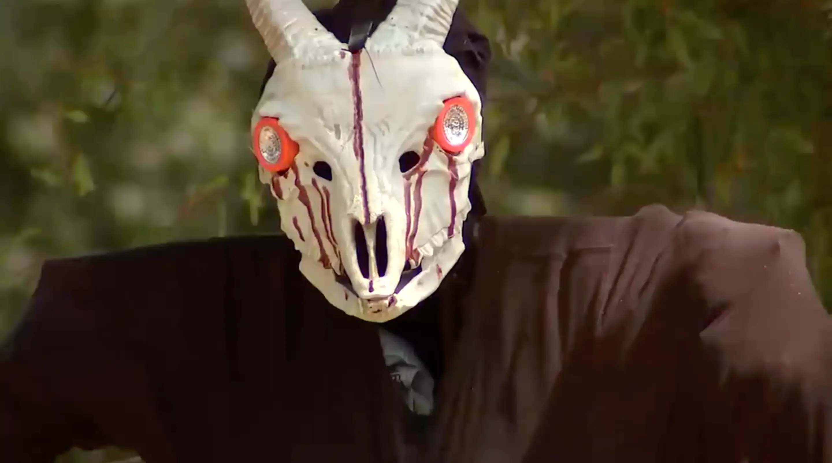 The decoration is a 'body' hanging from a tree.