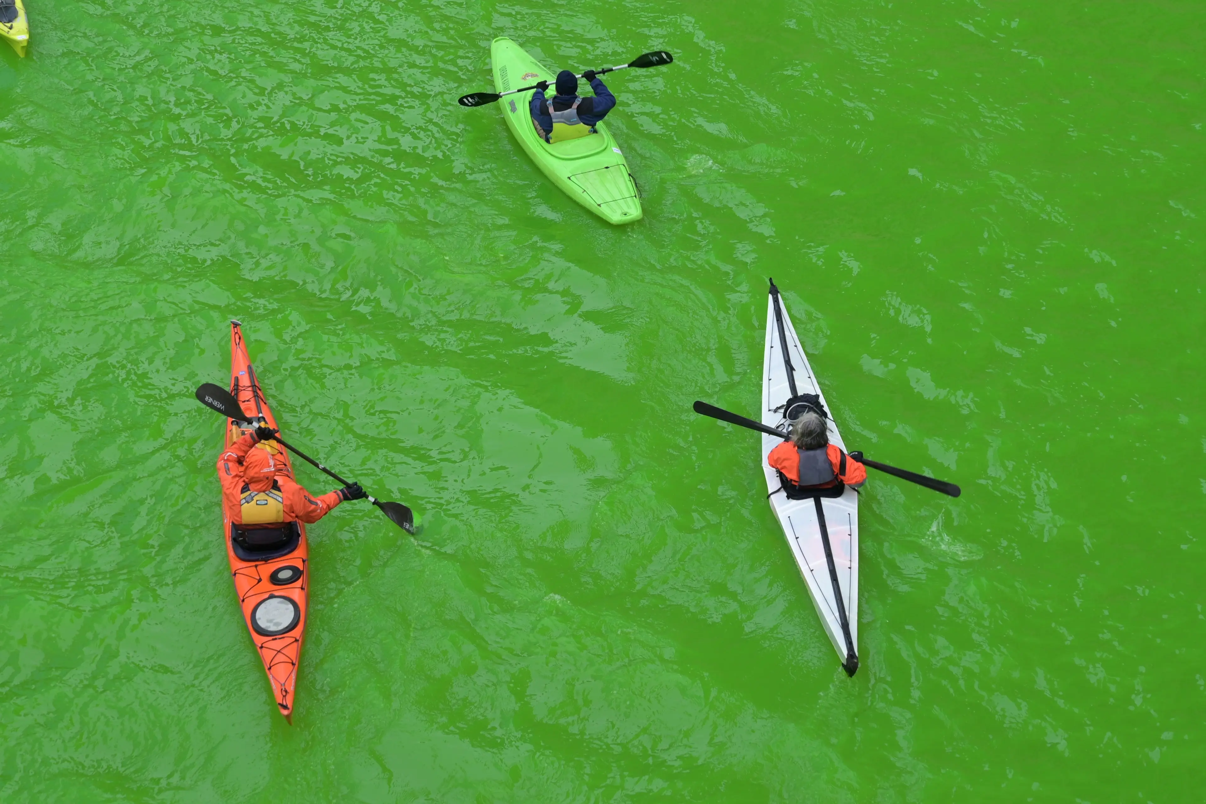 The unusual color didn't stop people from getting on the water (Jacek Boczarski/Anadolu via Getty Images)