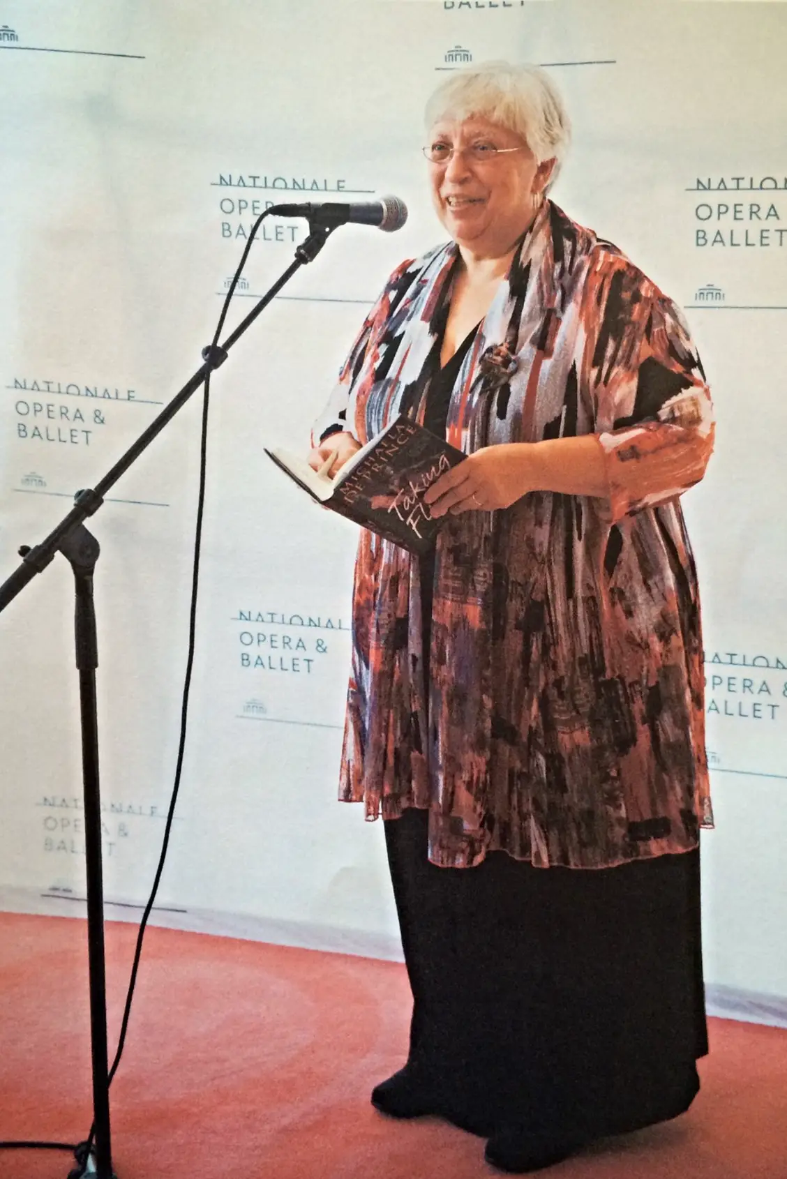 Proud mom Elaine DePrince reading her daughter's book in Amsterdam (Facebook/Elaine DePrince)