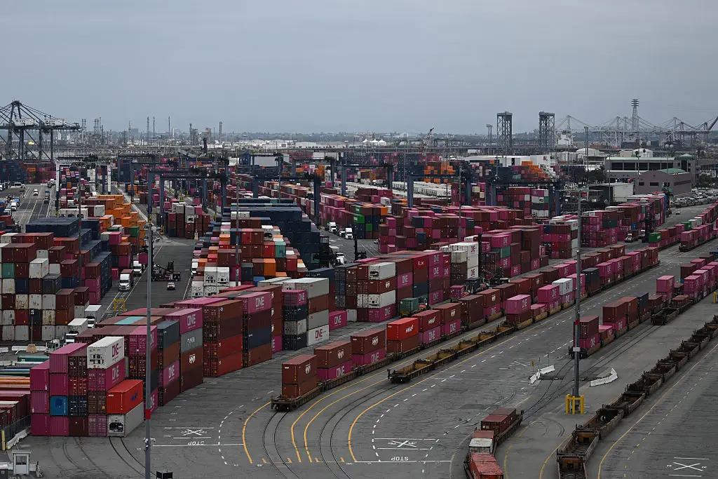 Shipping containers sit stacked on trains at the Port of Los Angeles in San Pedro, California (PATRICK T. FALLON/AFP via Getty Images)