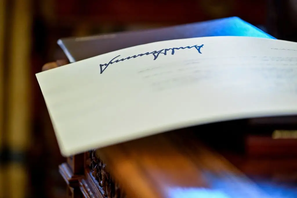 The currency will feature Trump's signature (ROBERTO SCHMIDT/AFP via Getty Images)