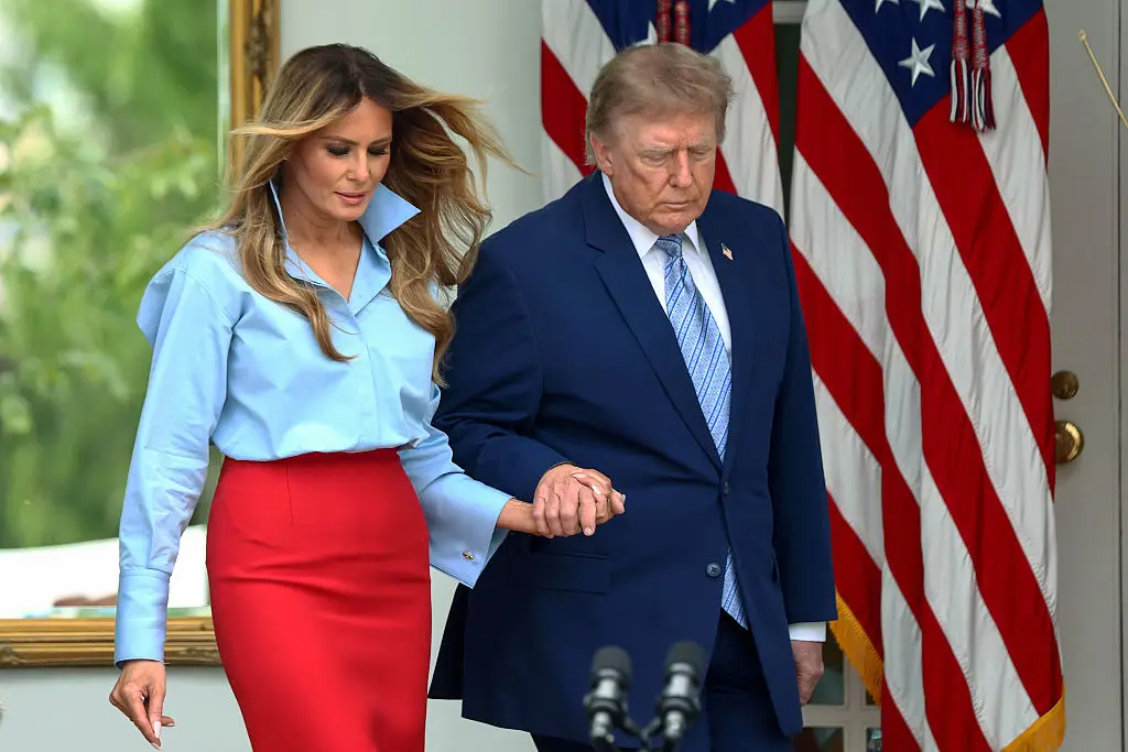 President Donald Trump and first lady Melania Trump arrive during an event announcing the expansion of a foster care initiative in the Rose Garden. (Photo by Finn Gomez/Getty Images)