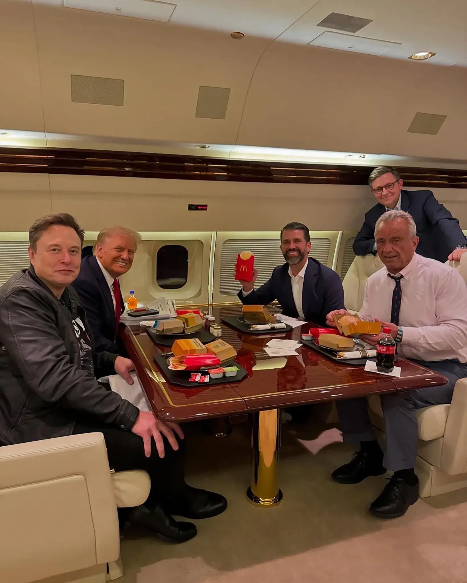 While Department of Agriculture Secretary Brooke Rollins hails President Donald Trump's 'bold leadership' following the introduction to a new dietary guideline, here's a look back at that now-famous McDonald's meal - Trump indulging in a McDonald's on a private jet alongside his former 'first buddy' Elon Musk, his health secretary Robert F. Kennedy Jr, and his eldest son Donald Trump Jr, back in November 2024 (X/@realDonaldTrump)