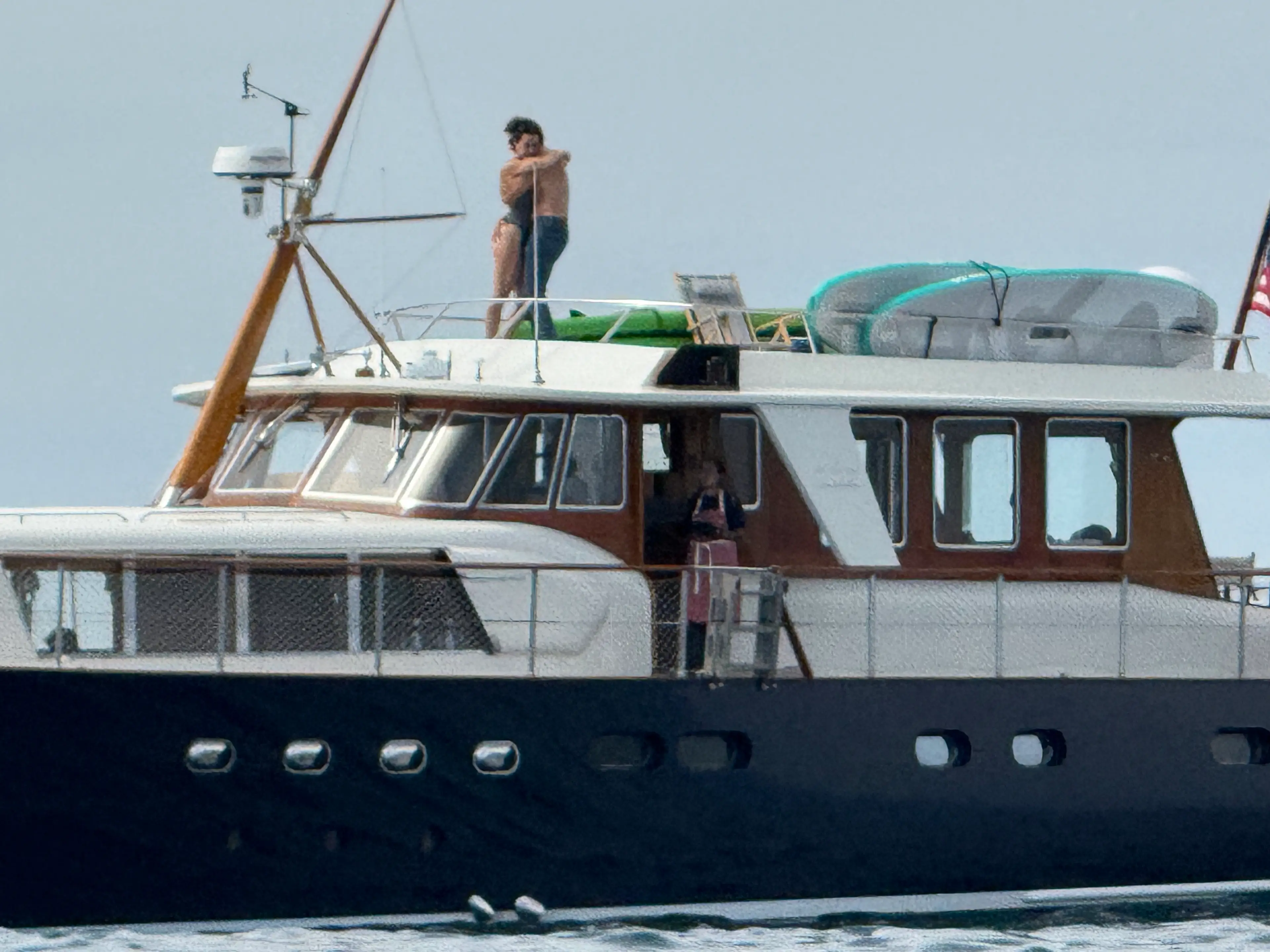 The pair shared an intimate moment on Perry's yacht (SWNS)