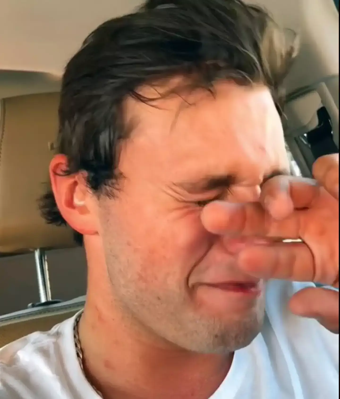Austin Wallace is seen fighting tears in the viral video. (TikTok/@aj_wallace69)