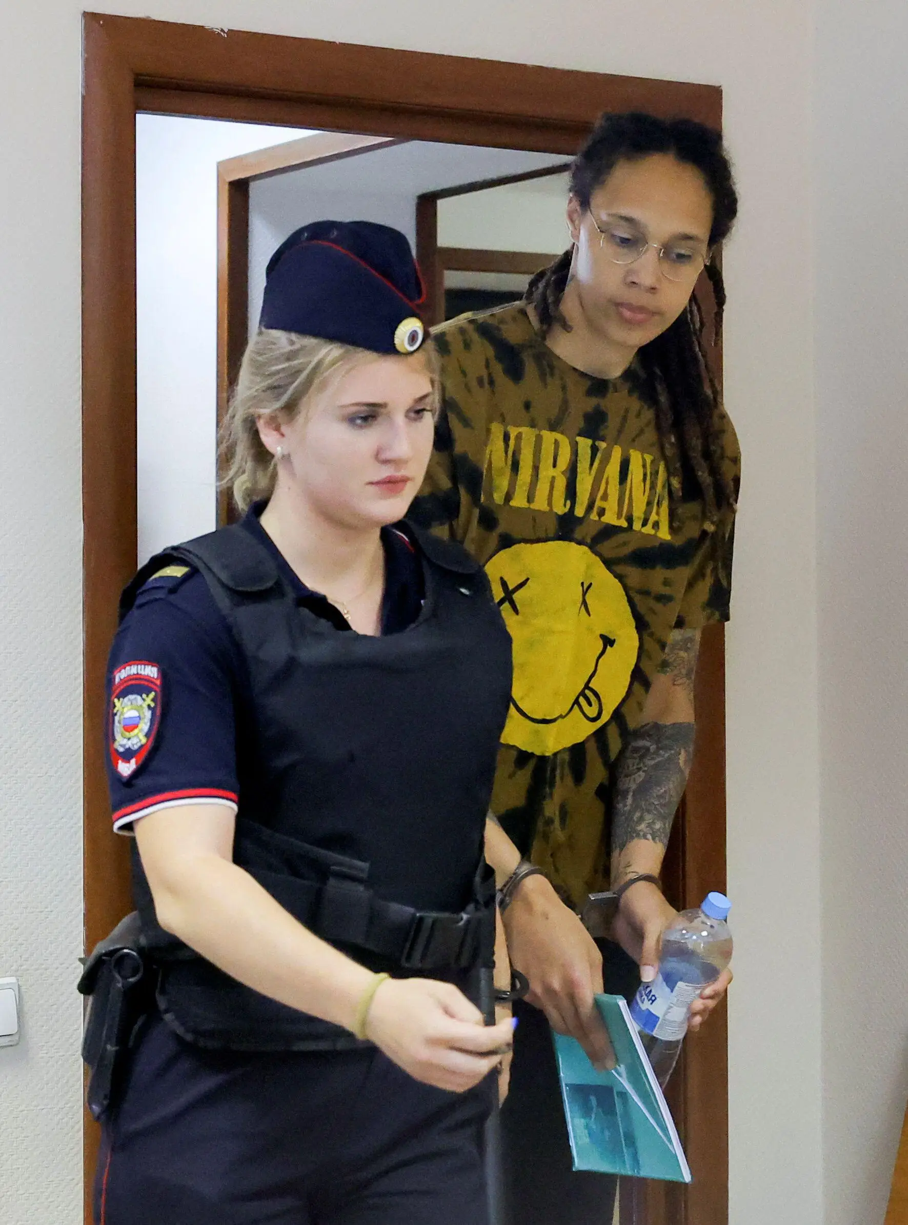 Griner being escorted before a court hearing.