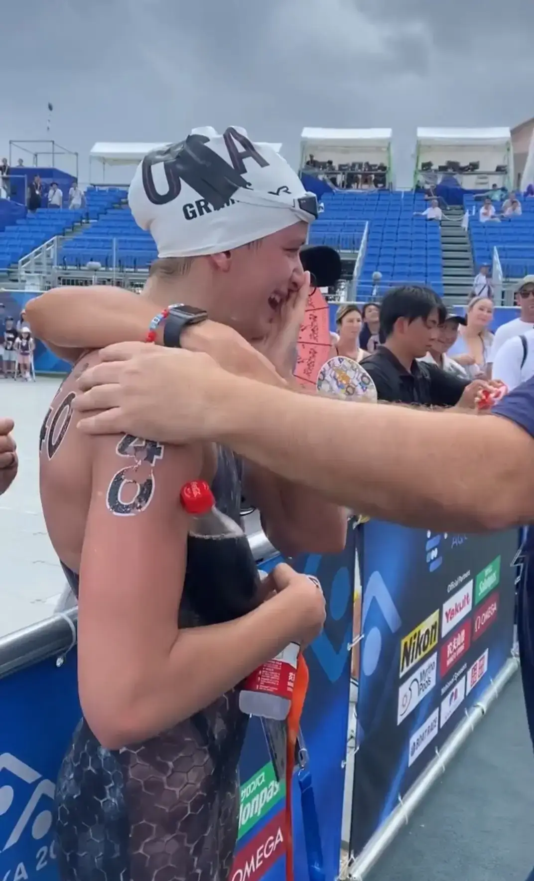 Katie Grimes grips onto a bottle of Coca-Cola last year after qualifying for the Paris 2024 Olympics. (Instagram/@usaswimming)