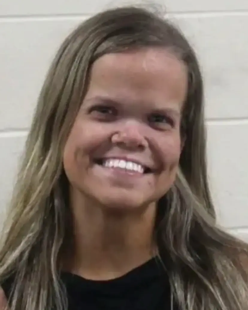Johnston raised eyebrows with her beaming smile in her post-arrest mugshot (Houston County Sheriff's Office)