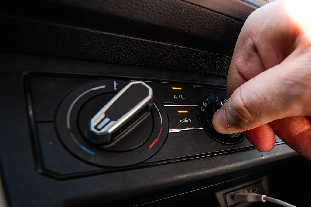 Once you go above 45mph, the extra aerodynamic drag created by open windows can actually burn more fuel than simply running the air conditioning. (Photo by EMILE WINDAL / BELGA MAG / Belga / AFP via Getty Images)
