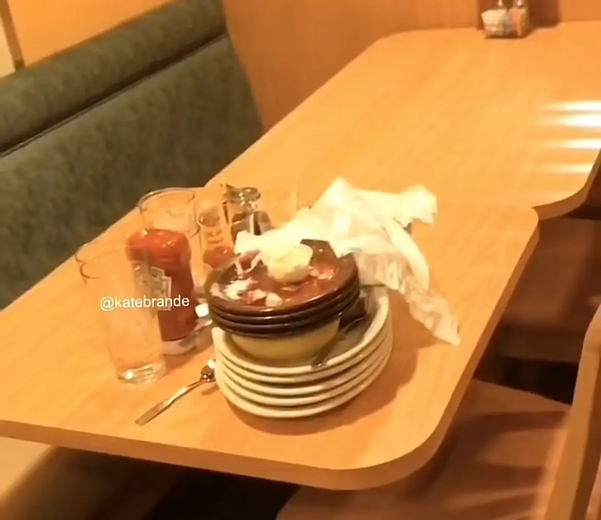 The table of Gen Z's all stacked their plates tidily.