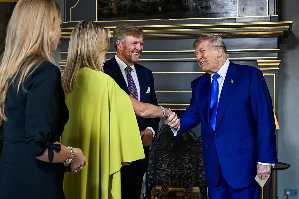 Trump is said to be 6ft 3in (MISCHA SCHOEMAKER/POOL/AFP via Getty Images)