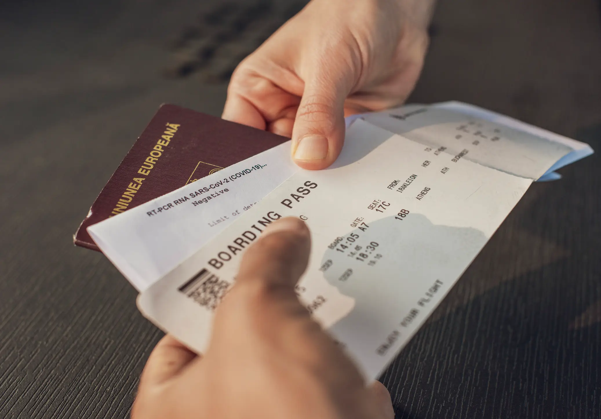 A passenger handing over their boarding pass & passport (Getty Images)