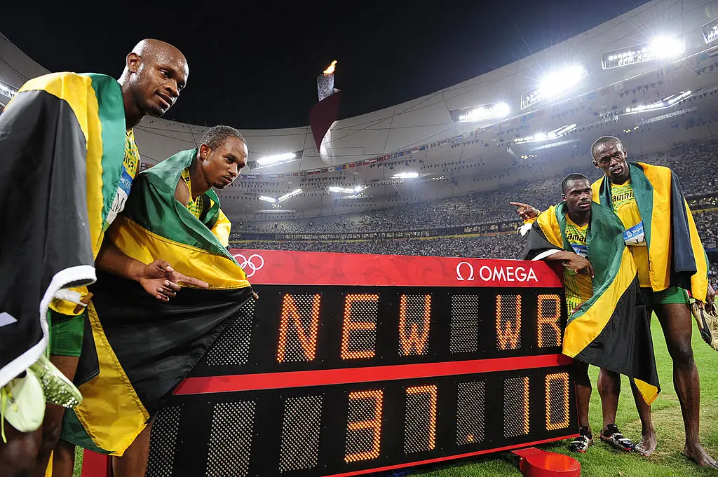 Team Jamaica with their world record-winning time, before it was stripped from them (GABRIEL BOUYS/AFP via Getty Images)