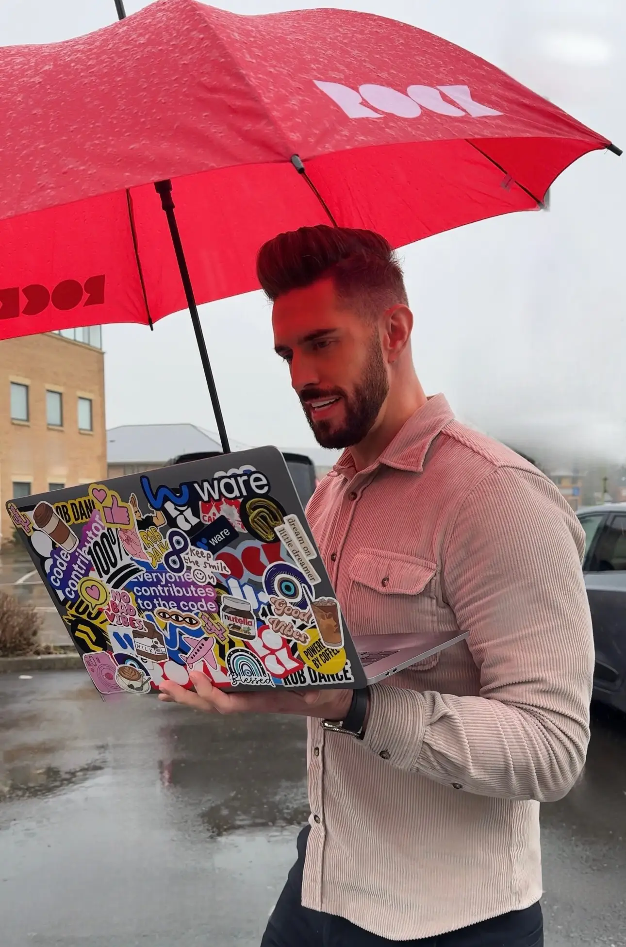 'Douchebag' Rob Dance working in the rain. (X/@RobDance_)