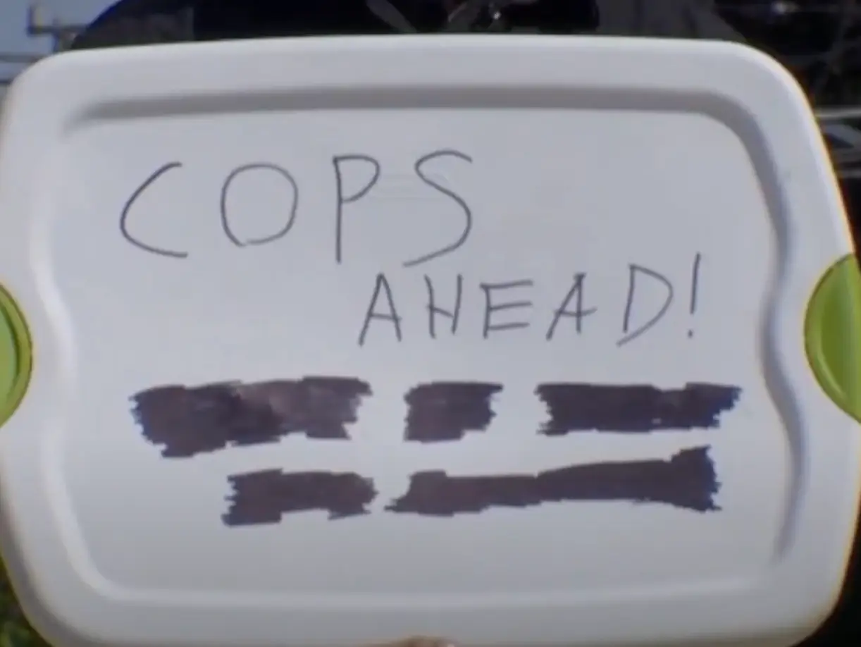 The man received a fine for holding up the sign (KOMO News)