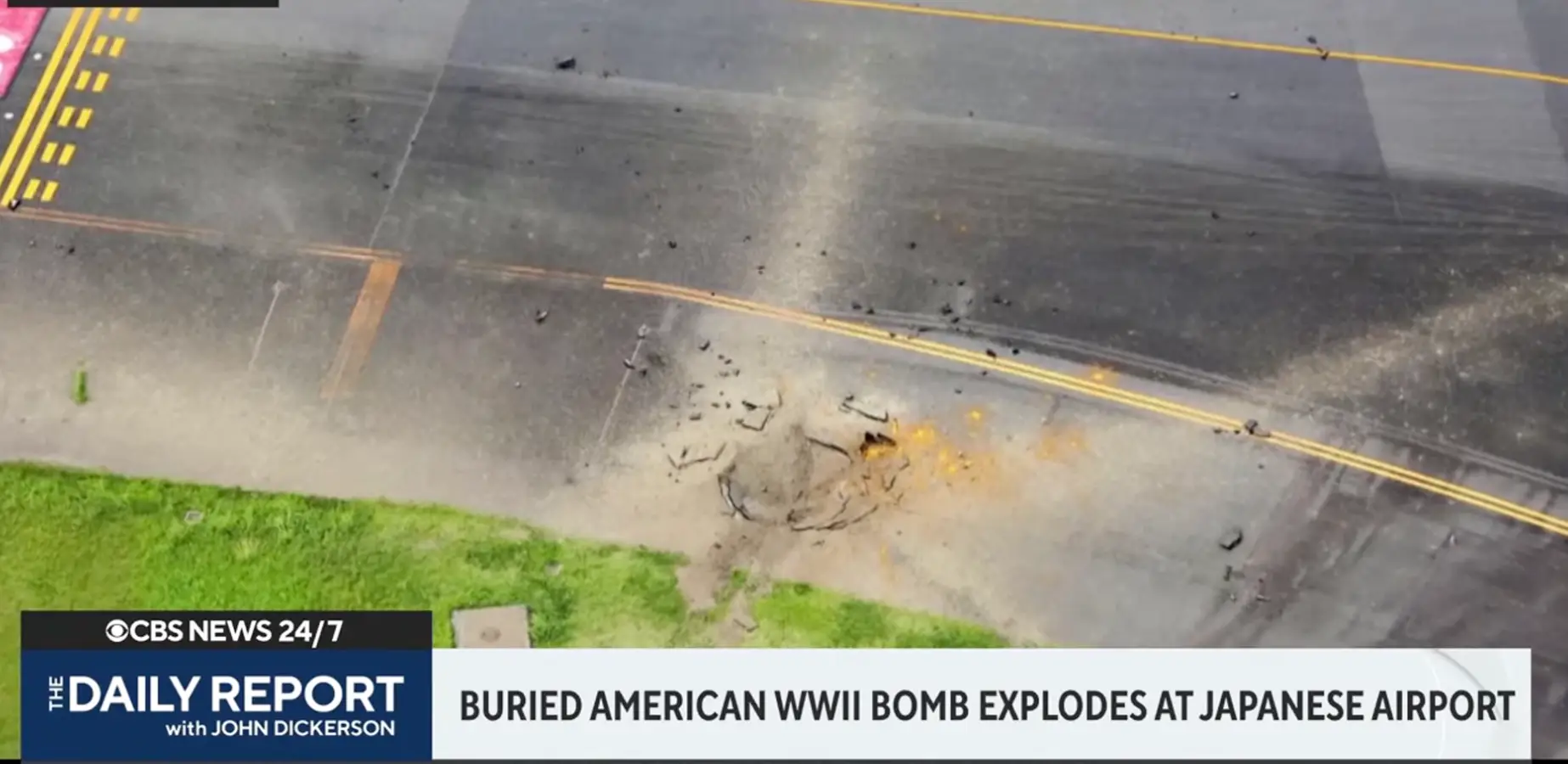 The explosion left a large crater in the taxiway (CBS News)