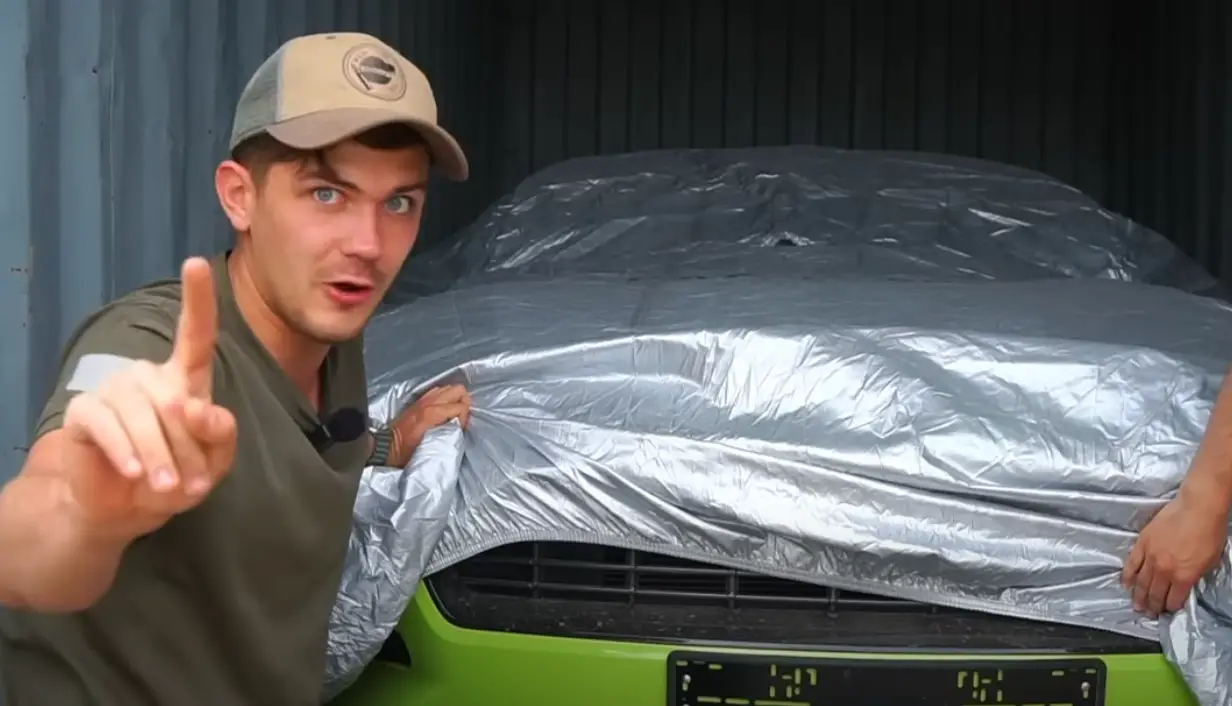 The question is what car lies underneath the cover? (YouTube/ SLAV's ADVENTURES)