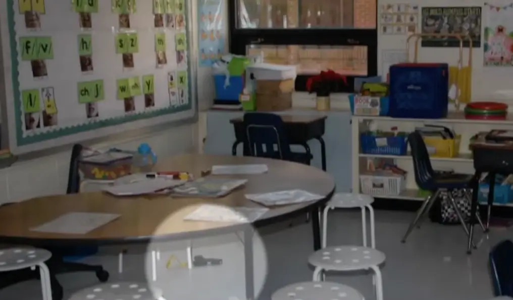 A gun is seen on the floor of the classroom (NBC News)