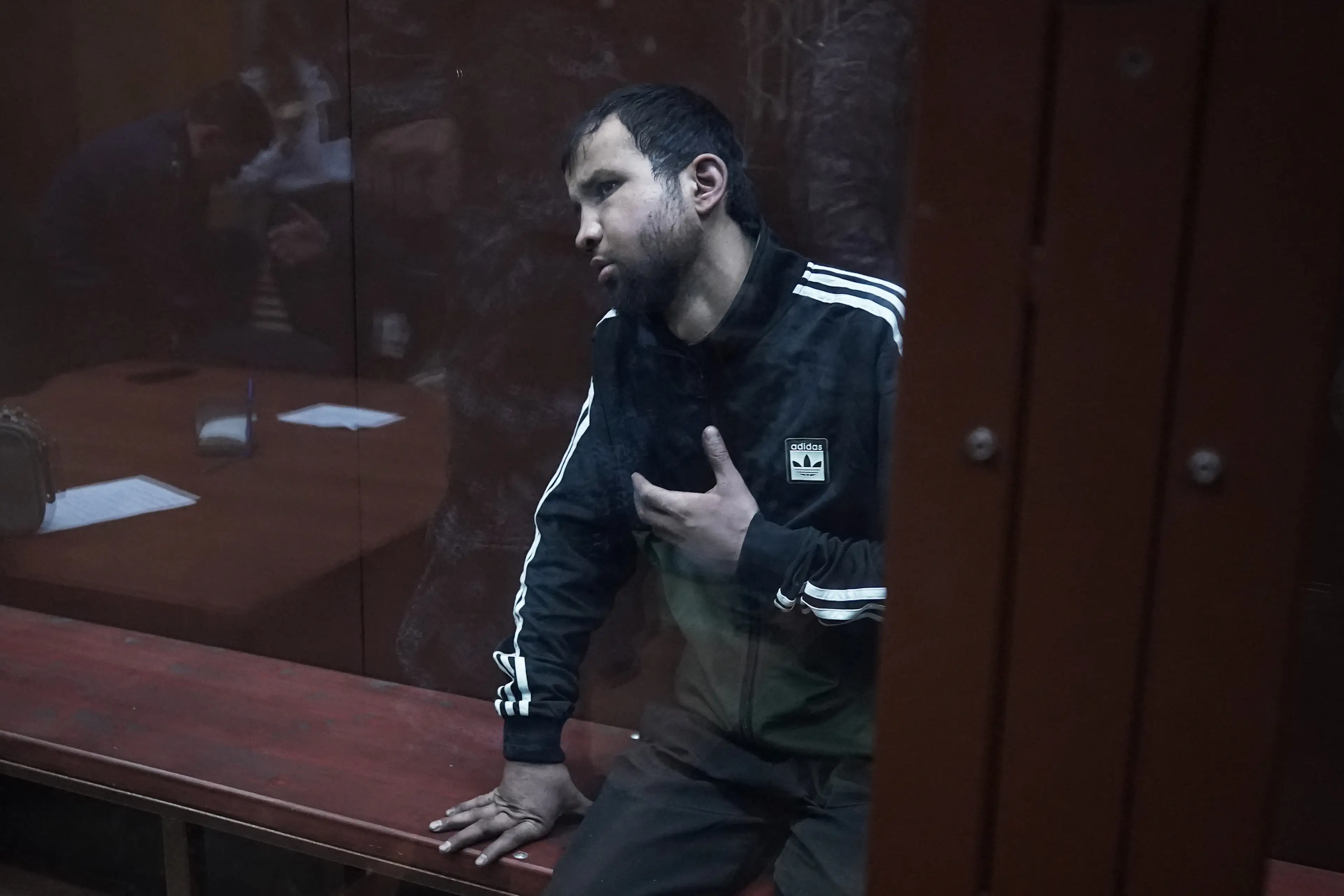 The suspects appeared to be injured as they arrived to court.