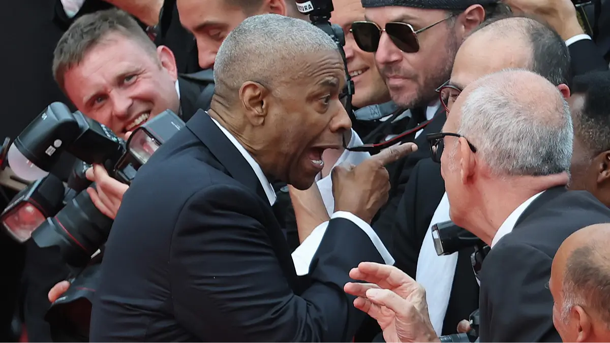 Body language expert breaks down Denzel Washington's 'aggressive' response to photographer on Cannes red carpet
