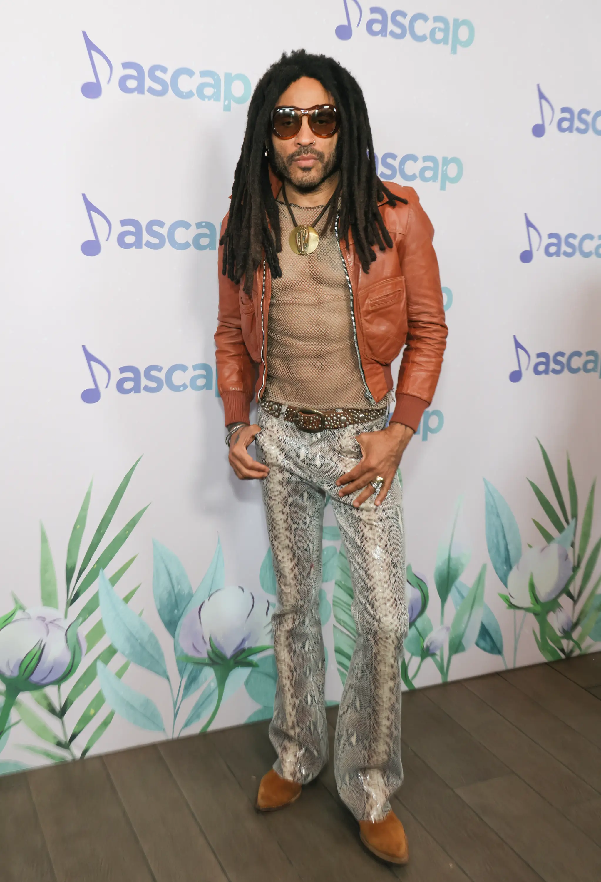 Lenny Kravitz loves a mesh shirt.