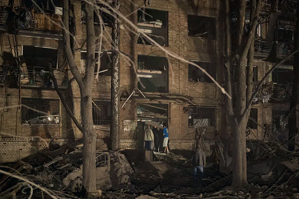 Rescuers and civilians worked to pull victims from the rubble of a missile strike on a residential building that took place in the early hours of this morning, local time (Kostiantyn Liberov/Libkos/Getty Images)