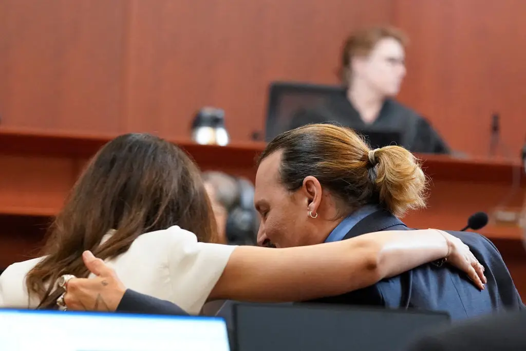 Johnny Depp talks with his attorney Camille Vasquez during the infamous Depp vs Heard defamation trial in 2022 (STEVE HELBER/POOL/AFP via Getty Images)