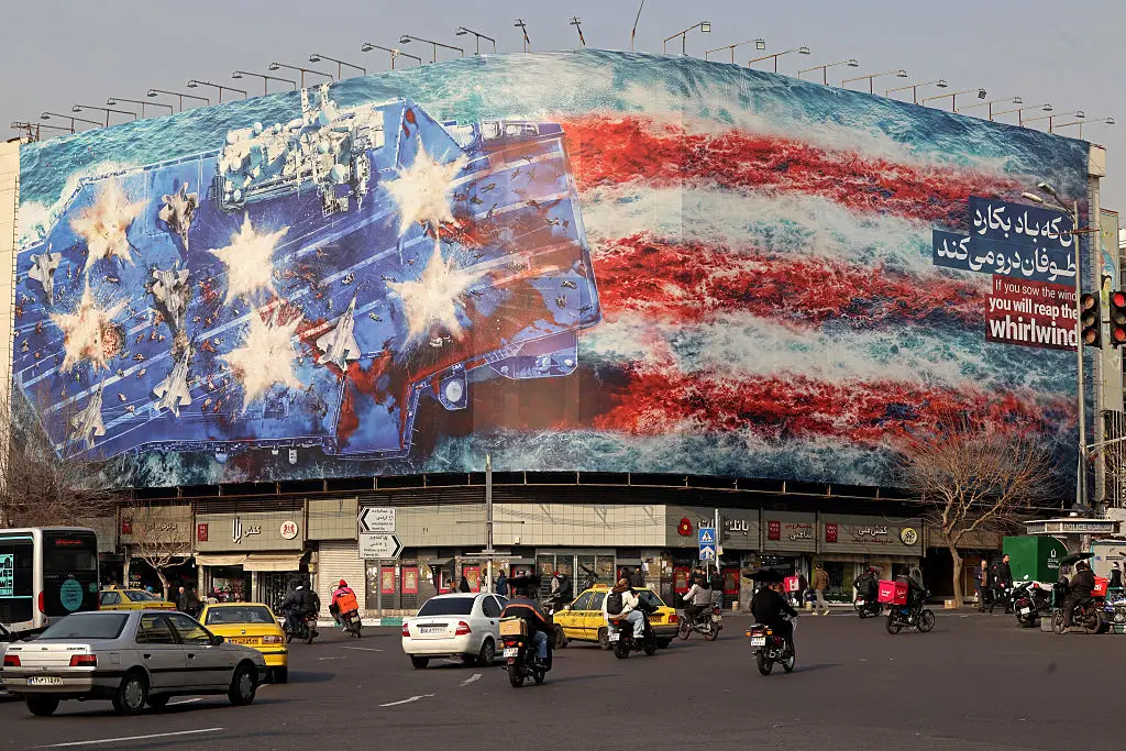 Anti-American propaganda has appeared across Tehran in recent days including one stating 'if you sow the wind you reap the whirlwind' (ATTA KENARE / AFP via Getty Images)