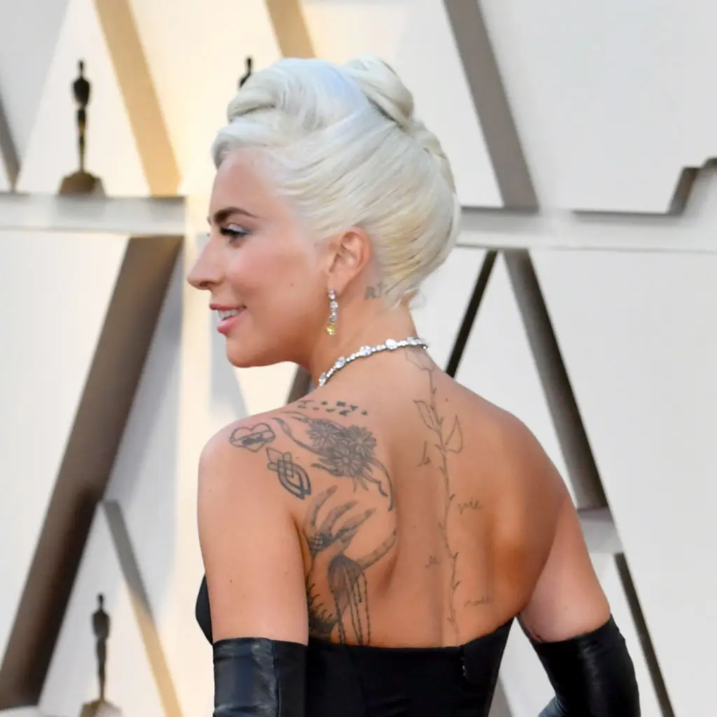 Lady Gaga has a rose tattoo running down her spine (Photo by Jeff Kravitz/FilmMagic)