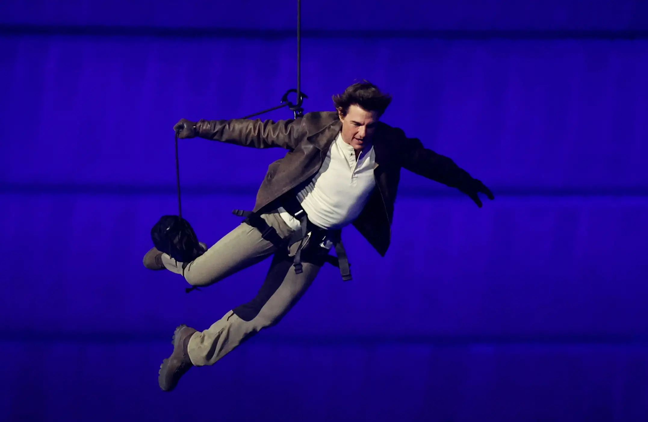 Tom Cruise performed a Mission: Impossible-style stunt at the closing ceremony. (Fabrizio Bensch- Pool/Getty Images)