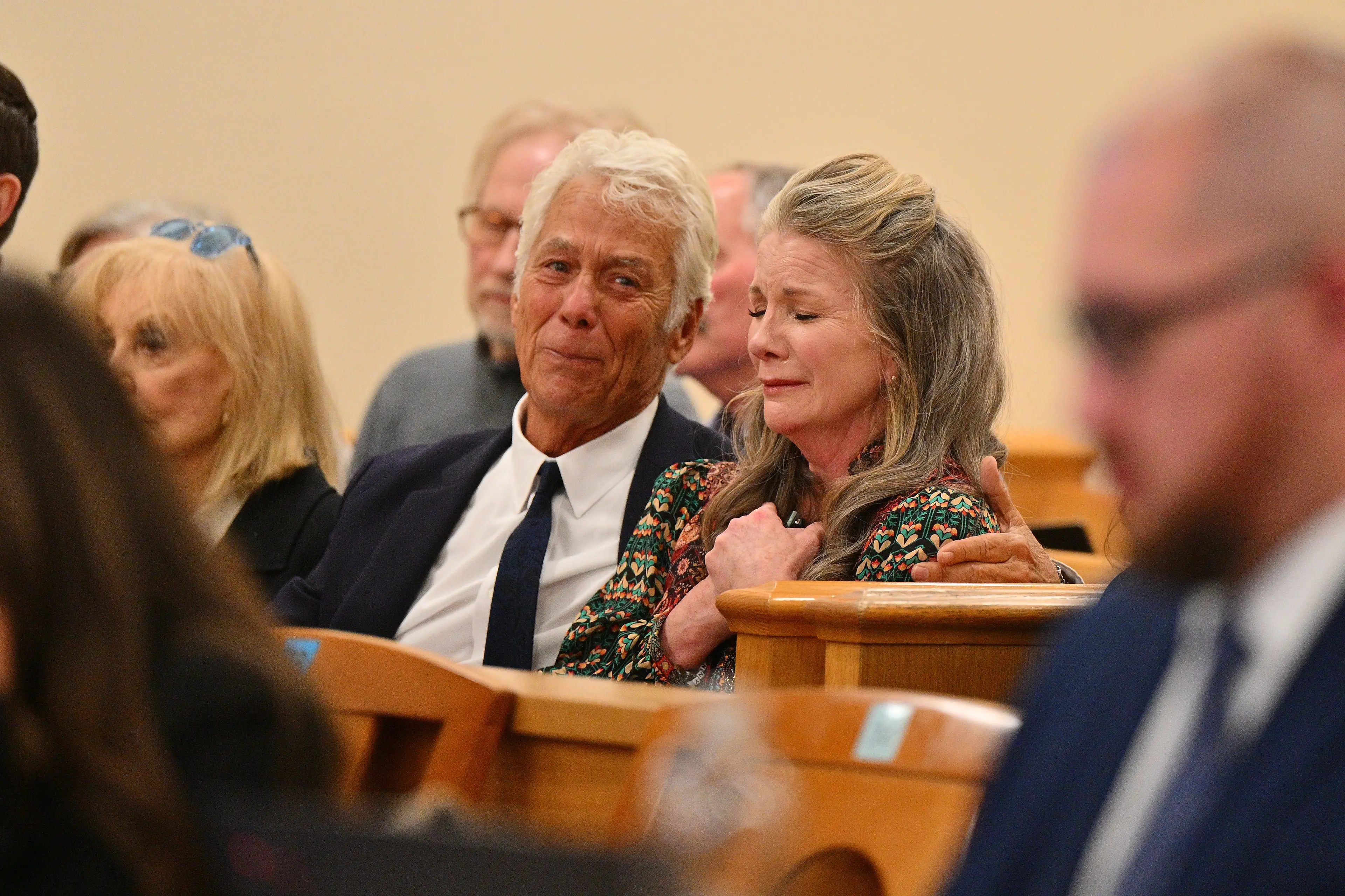 Attorney Larry Stein (L) and Melissa Gilbert, wife of director and actor Timothy Busfield, react after a judge granted Busfield a pre-trial release (Sam Wasson / Getty Images)